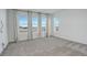 Bedroom featuring large windows with white curtains and views of the city at 11063 Shining Star Cir, Parker, CO 80134