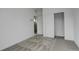 A carpeted bedroom features white walls, closet and doors at 11063 Shining Star Cir, Parker, CO 80134