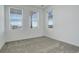 Bedroom featuring three windows with views and neutral carpet at 11063 Shining Star Cir, Parker, CO 80134