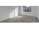 Bright bedroom with a large window and neutral carpet at 11063 Shining Star Cir, Parker, CO 80134