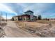 A modern community center with stone and siding and a well manicured lawn at 11063 Shining Star Cir, Parker, CO 80134