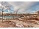 A community pool surrounded by landscaping, walking paths, and neighborhood homes at 11063 Shining Star Cir, Parker, CO 80134