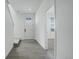 Hallway with tiled floor, a white front door and stairs at 11063 Shining Star Cir, Parker, CO 80134