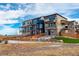 Modern townhomes showcasing appealing architecture, balconies, and private entrances for easy access at 11063 Shining Star Cir, Parker, CO 80134