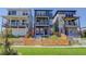 Three lovely homes with covered entryways and fenced yards create a welcoming street view at 11063 Shining Star Cir, Parker, CO 80134