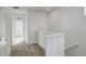 Upstairs hallway with carpet flooring, white walls, and white doors at 11063 Shining Star Cir, Parker, CO 80134