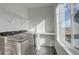 Bright laundry room featuring new washer and dryer, counter space, and natural light at 11063 Shining Star Cir, Parker, CO 80134