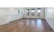 Bright living room featuring hardwood floors, large windows, and a door leading to an outdoor space at 11063 Shining Star Cir, Parker, CO 80134