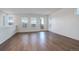 Bright living room with wood floors, white walls, large windows, and an outdoor patio at 11063 Shining Star Cir, Parker, CO 80134