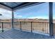 Open patio with a black metal railing and views of the city at 11063 Shining Star Cir, Parker, CO 80134