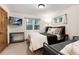 Bedroom with two beds, a TV, and a large window with forest views at 384 Blue Ridge Rd, Breckenridge, CO 80424