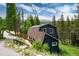 Charming exterior of this home with a view of nature and a peaked roof at 384 Blue Ridge Rd, Breckenridge, CO 80424