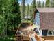 Exterior view of a two-story home featuring a spacious deck perfect for outdoor entertaining at 384 Blue Ridge Rd, Breckenridge, CO 80424