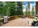 Exterior view of a deck featuring stainless steel BBQ, dining and a lounge space for entertaining at 384 Blue Ridge Rd, Breckenridge, CO 80424