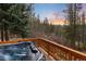 Hot tub on a wooden deck with beautiful views of the surrounding forest and mountain landscape at 384 Blue Ridge Rd, Breckenridge, CO 80424