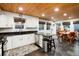 Kitchen with white cabinets, stainless steel appliances, granite counters and a breakfast nook at 384 Blue Ridge Rd, Breckenridge, CO 80424