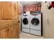 Convenient laundry room with side by side washer and dryer with tile floor at 384 Blue Ridge Rd, Breckenridge, CO 80424