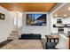 Living room with TV and stair access to other rooms with an open view to the kitchen at 384 Blue Ridge Rd, Breckenridge, CO 80424