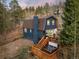 Two-story home featuring a hot tub and exterior deck perfect for enjoying the outdoors at 384 Blue Ridge Rd, Breckenridge, CO 80424