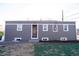 Home's backyard and exterior showing the newly renovated facade at 6190 Ivy St, Commerce City, CO 80022