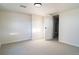 Bright basement bedroom with neutral carpet and fresh paint leading to other rooms at 6190 Ivy St, Commerce City, CO 80022