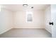 Bright basement bedroom with neutral carpet, window, and fresh paint at 6190 Ivy St, Commerce City, CO 80022