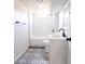 Modern renovated bathroom with stylish tile, white subway tile shower, and sink at 6190 Ivy St, Commerce City, CO 80022