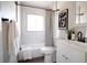 Chic bathroom featuring marble-look tiles, a modern vanity, and elegant fixtures, creating a stylish space at 6190 Ivy St, Commerce City, CO 80022