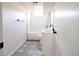 Modern renovated bathroom with stylish tile, white subway tile shower, and sink at 6190 Ivy St, Commerce City, CO 80022