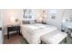 Bright bedroom featuring a comfortable bed with stylish decor and ample natural light from the windows at 6190 Ivy St, Commerce City, CO 80022