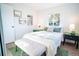 Inviting bedroom with a cozy bed, stylish nightstands, soft lighting, and a comfortable bench at 6190 Ivy St, Commerce City, CO 80022