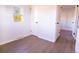Clean bedroom showcasing wood-look flooring, a bright window, and neutral paint at 6190 Ivy St, Commerce City, CO 80022