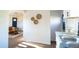 Stylish kitchen seamlessly connected to the living room, featuring white cabinets and an open, airy design at 6190 Ivy St, Commerce City, CO 80022