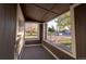 View from the porch featuring a bench and natural light at 6190 Ivy St, Commerce City, CO 80022