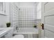 Bright white bathroom featuring tiled shower, tub, and vintage-style sink at 1239 N Lafayette St, Denver, CO 80218