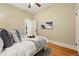 Bedroom with hardwood floors, neutral paint, and a queen size bed at 1239 N Lafayette St, Denver, CO 80218