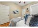 Cozy bedroom featuring a queen size bed, hardwood floors, and neutral paint at 1239 N Lafayette St, Denver, CO 80218