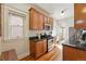 Efficient kitchen featuring wood cabinets, stainless steel appliances, granite countertops, and ample storage space at 1239 N Lafayette St, Denver, CO 80218