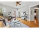 Inviting living room featuring hardwood floors, a window providing natural light, and neutral decor for a welcoming atmosphere at 1239 N Lafayette St, Denver, CO 80218