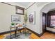 Cozy office with hardwood floors, neutral paint, and a decorative bear art piece at 1239 N Lafayette St, Denver, CO 80218