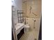 Bathroom features a walk in tub/shower and white sink and cabinet at 2597 S Dillon St, Aurora, CO 80014