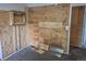Unfinished bedroom showing exposed wood and structural elements, ready for customization and renovation at 2597 S Dillon St, Aurora, CO 80014