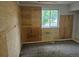 Bedroom with wall coverings and a window overlooking the neighborhood at 2597 S Dillon St, Aurora, CO 80014