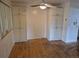 Dining room area featuring hardwood floors, cabinets, and ceiling fan at 2597 S Dillon St, Aurora, CO 80014