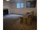 The spacious living room features a decorative fireplace and ample natural light at 2597 S Dillon St, Aurora, CO 80014
