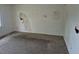 Empty living room offering ample space to design to your liking at 2597 S Dillon St, Aurora, CO 80014