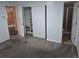 This bedroom features double doors, a closet, and an adjacent bathroom, providing convenience and functionality at 2597 S Dillon St, Aurora, CO 80014