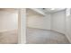 Spacious finished basement with carpet floors, support beam, and small window at 6579 Ingalls St, Arvada, CO 80003