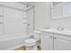 Full bathroom with tub, shower, vanity, and updated fixtures at 6579 Ingalls St, Arvada, CO 80003