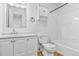 Well-lit bathroom features modern sink, toilet, and shower-tub combo at 6579 Ingalls St, Arvada, CO 80003